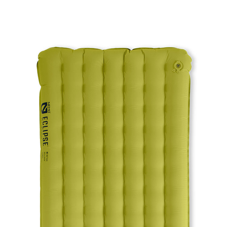The NEMO Equipment Eclipse™ All-Season Lightweight Insulated Sleeping Pad is a green, lightweight camping mattress with vertical air chambers and an upper right valve—ideal for comfortable backpacking on any adventure.
