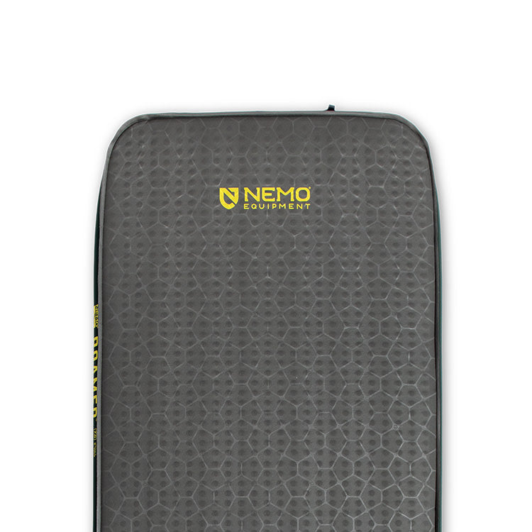 Close-up of a gray NEMO Equipment Roamer™ Self-Inflating Mattress featuring a textured hexagonal pattern and yellow logo near the top center.